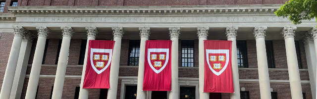 Harvard banners adorn the front of Widener Library.